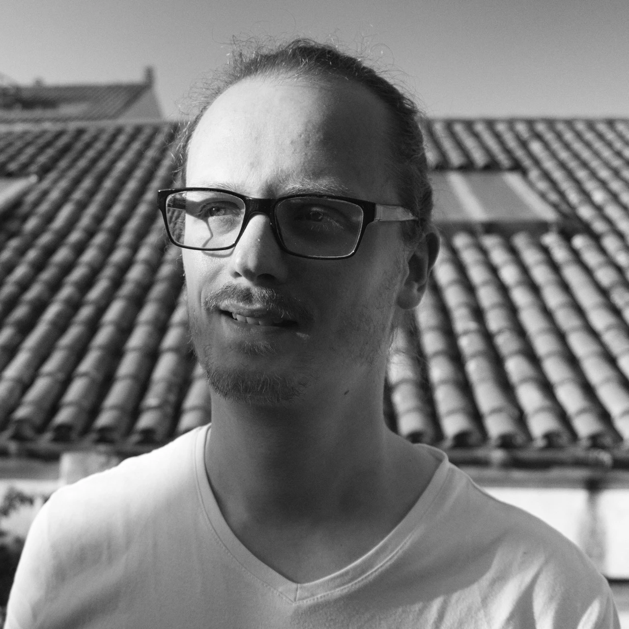 a man holding a microphone and talking to the camera, in a social media video